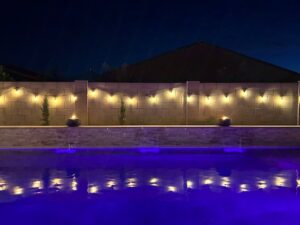 Swimming pool with water and fire features.