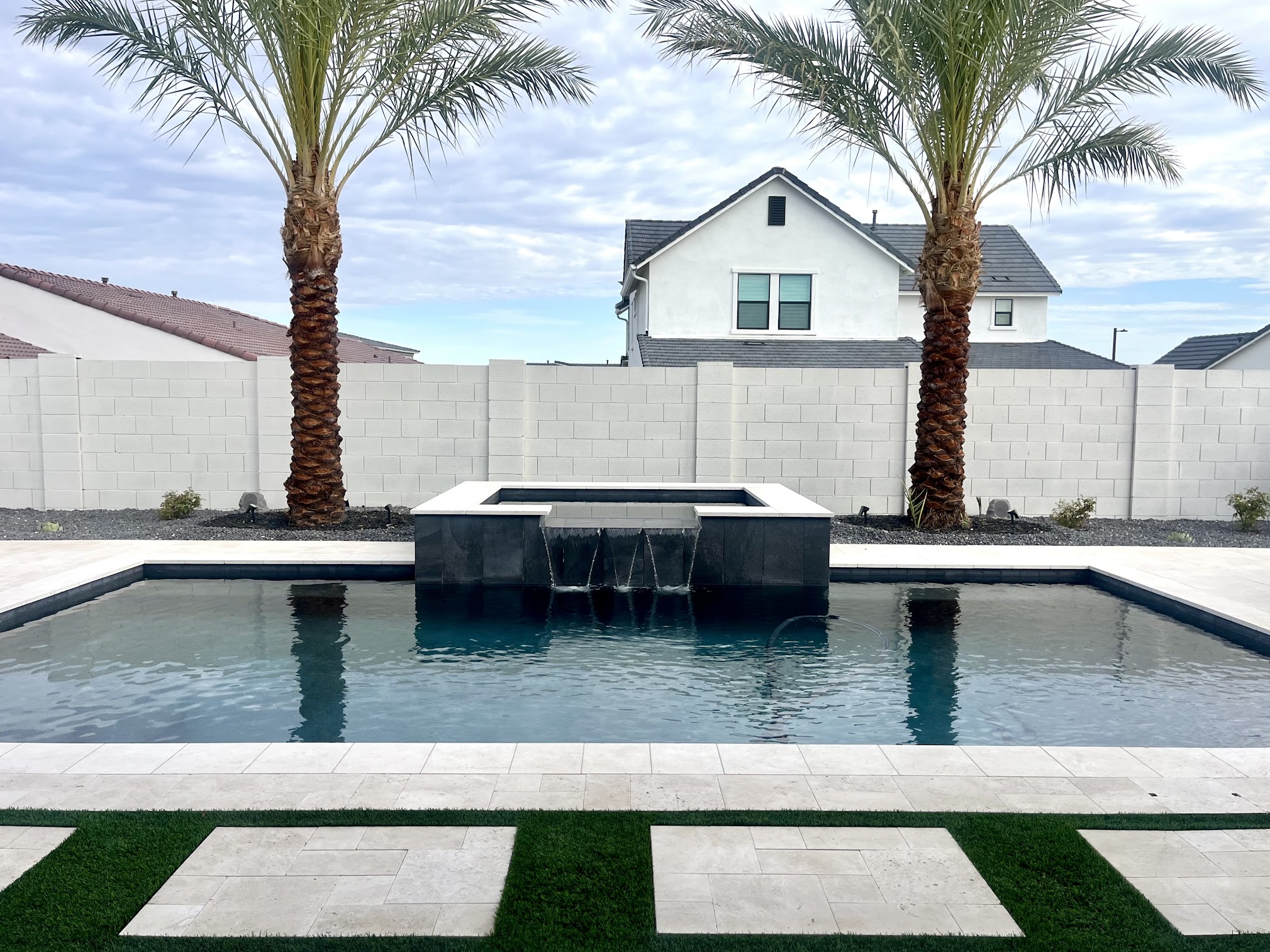 backyard pool and spa overflowing into waterfall - queen creek az.