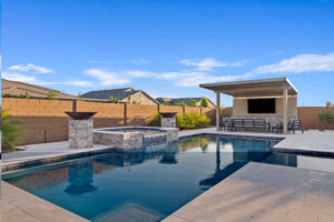 backyard pool and spa with custom firebowls, fire features and landscaping in Queen Creek.