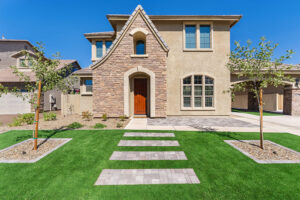front yard landscaping with custom pavers by Patriot Pools & Landscapes.