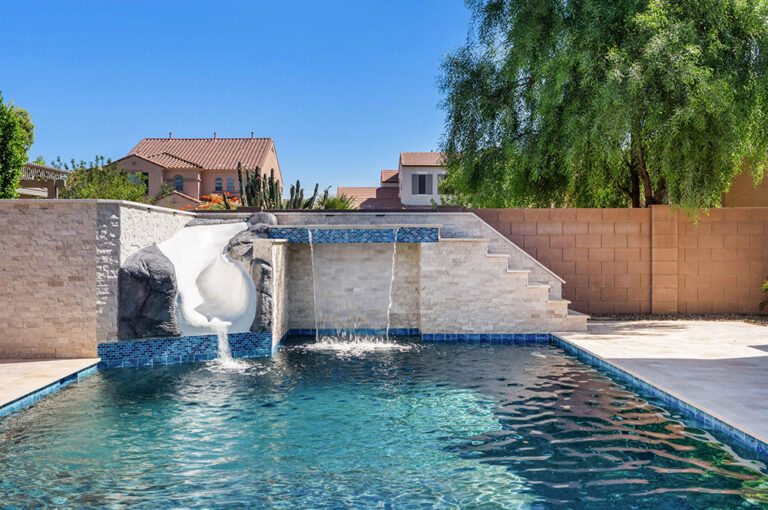 backyard pool with slide, fountain and grotto in queen creek.