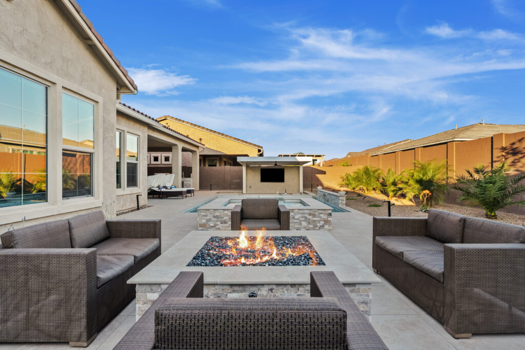 backyard remodel with firepit, spa, pool and outdoor media wall with bbq.